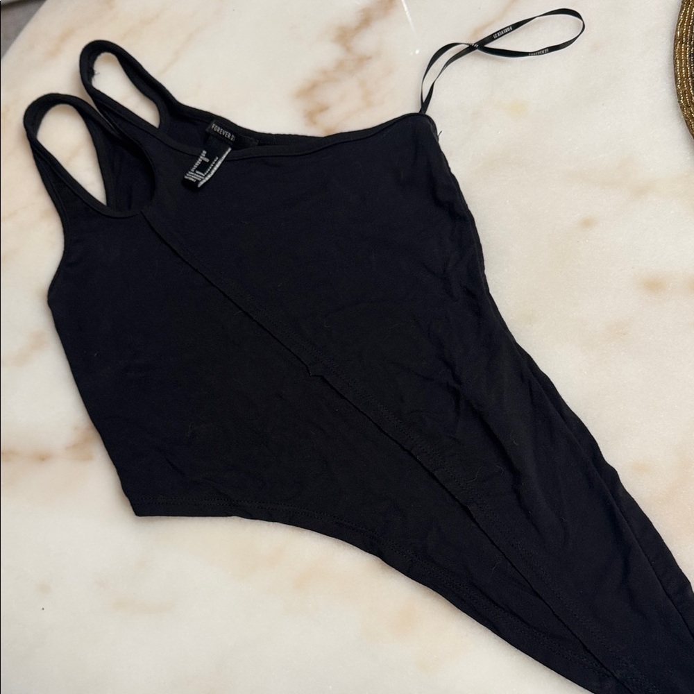 Black asymmetrical (one shoulder TANK) with asymmetry on bottom high and low. So